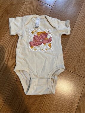 Cleetus McFarland Cream Baby One-Piece with Pink & Orange Graphic